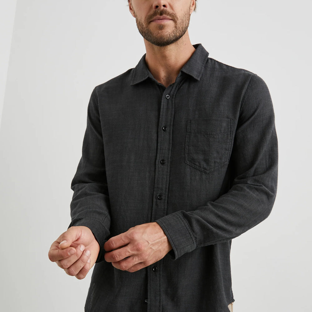 
                      
                        Front view of a man wearing the Black Chambray Long Sleeve Wyatt Shirt by Rail
                      
                    