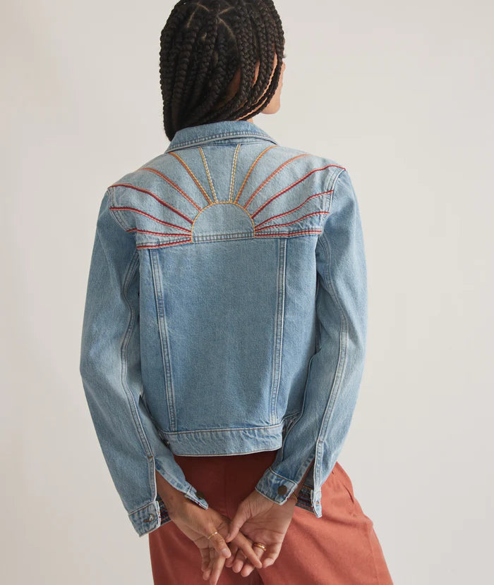 Back view of Marine Layer's Embroidered Denim Jacket in the color Light Denim