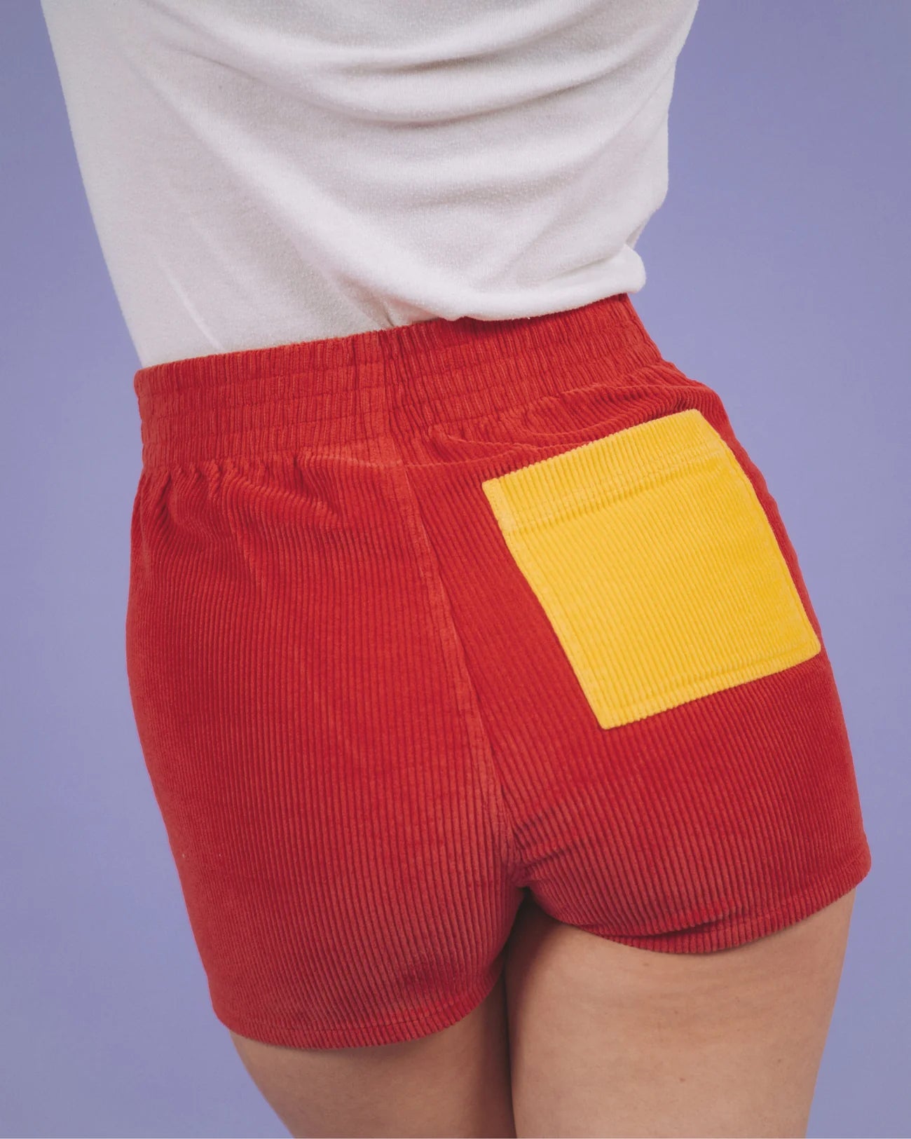 Back view of the two tone red and gold women's shorts by Hammies