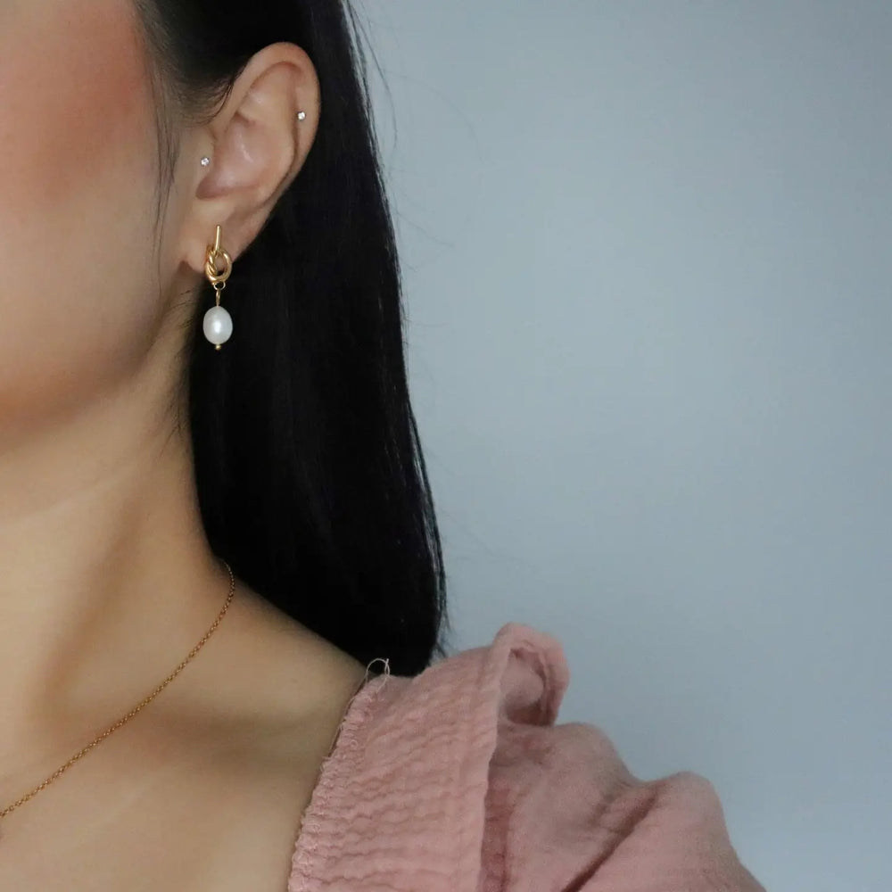 
                      
                        The Knotted Pearl Drop Earrings by Jessa Jewelry
                      
                    