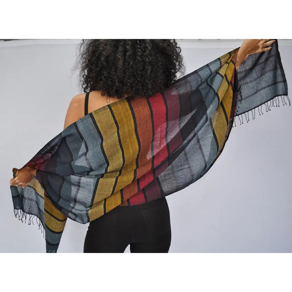 This oversized, handwoven wrap scarf from Slate + Salt is made of pure Ethiopian cotton and finished with black fringe edges.