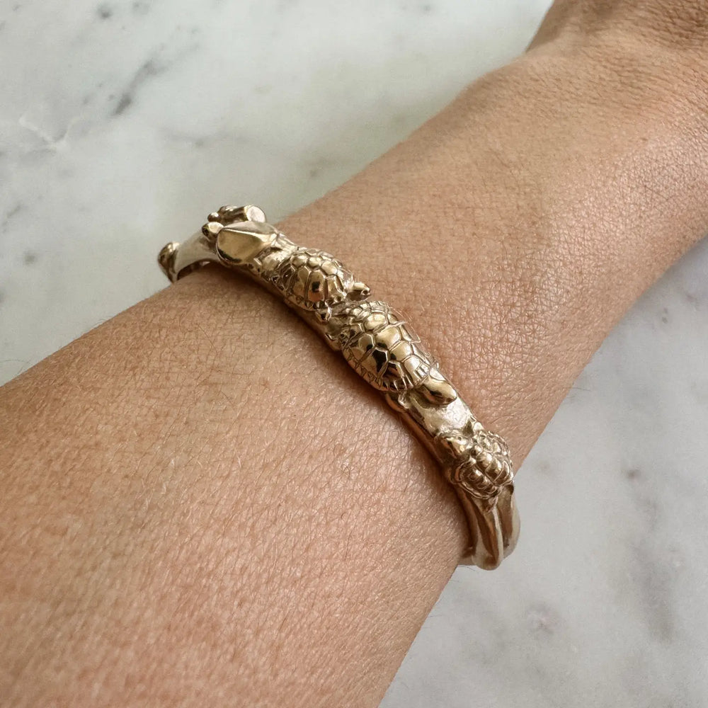 bronze cuff bracelet with turtles