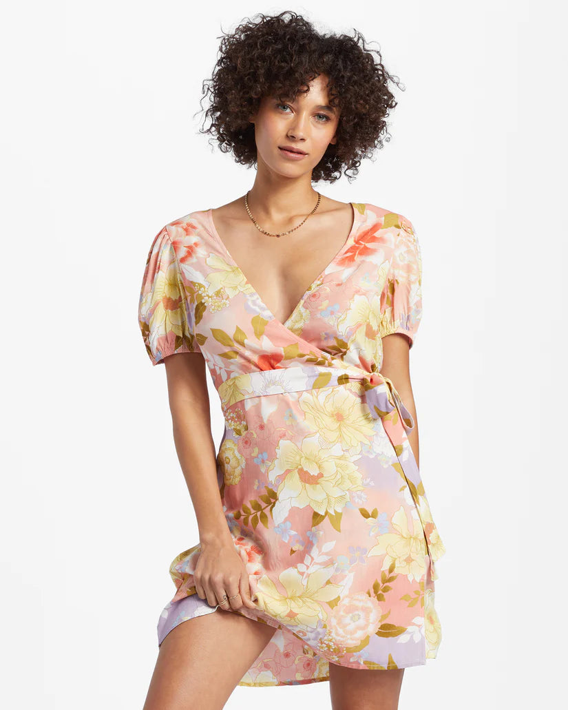 Front view of the Billabong Hot Tropics Mini Wrap Dress in the color Sweet Peach