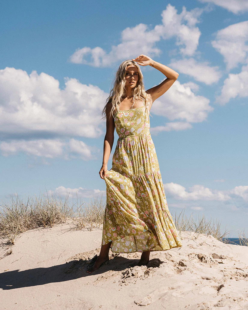 Woman at the beach wearing Billabong's Riviera Romance Dress in the color Green Envy