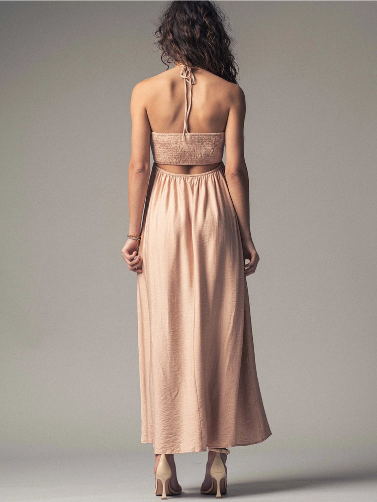 
                      
                        This flowy pink halter dress features a smocked back for an adjustable fit
                      
                    