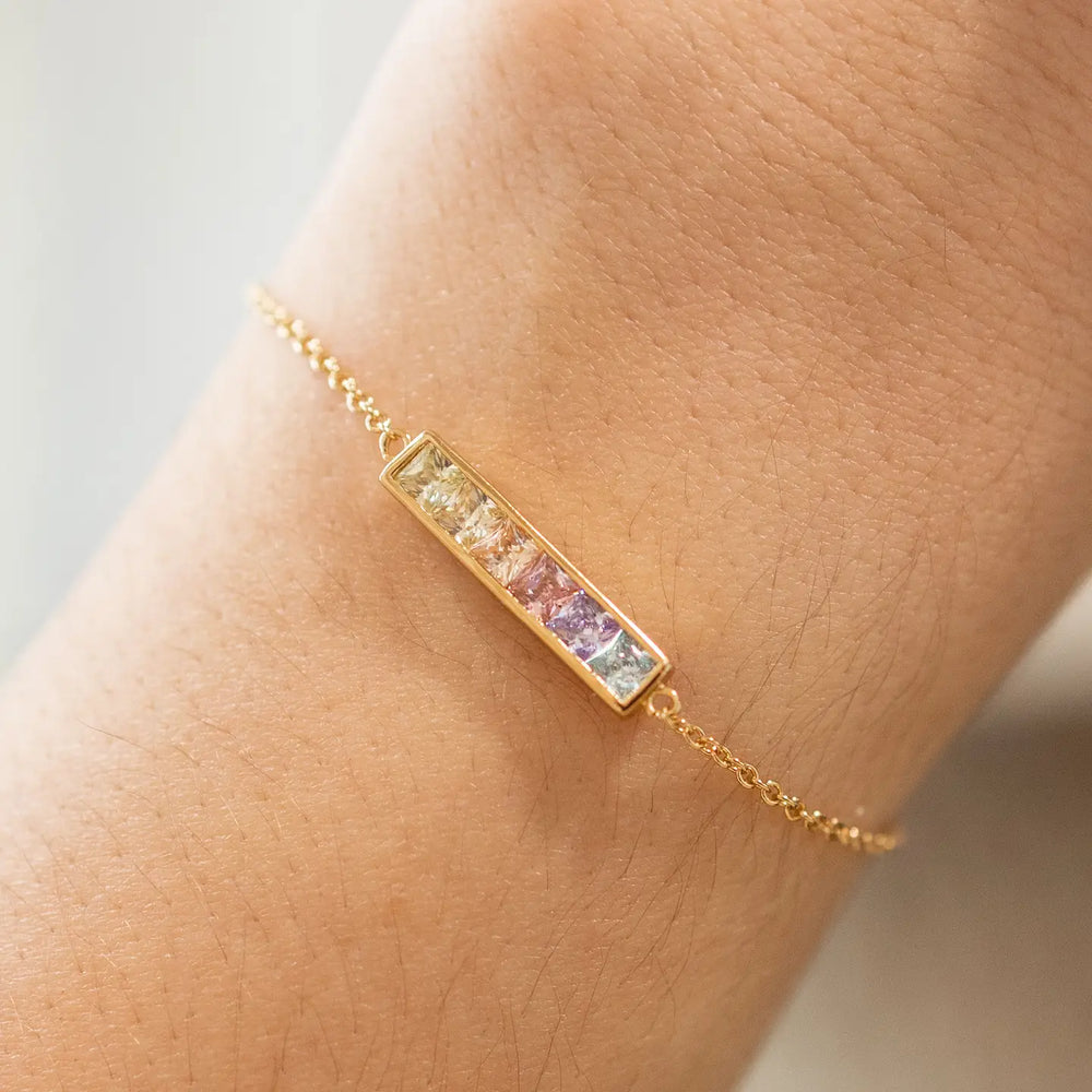 The Pastel Ombre Bar Bracelet from The Land Of Salt on a person's wrist