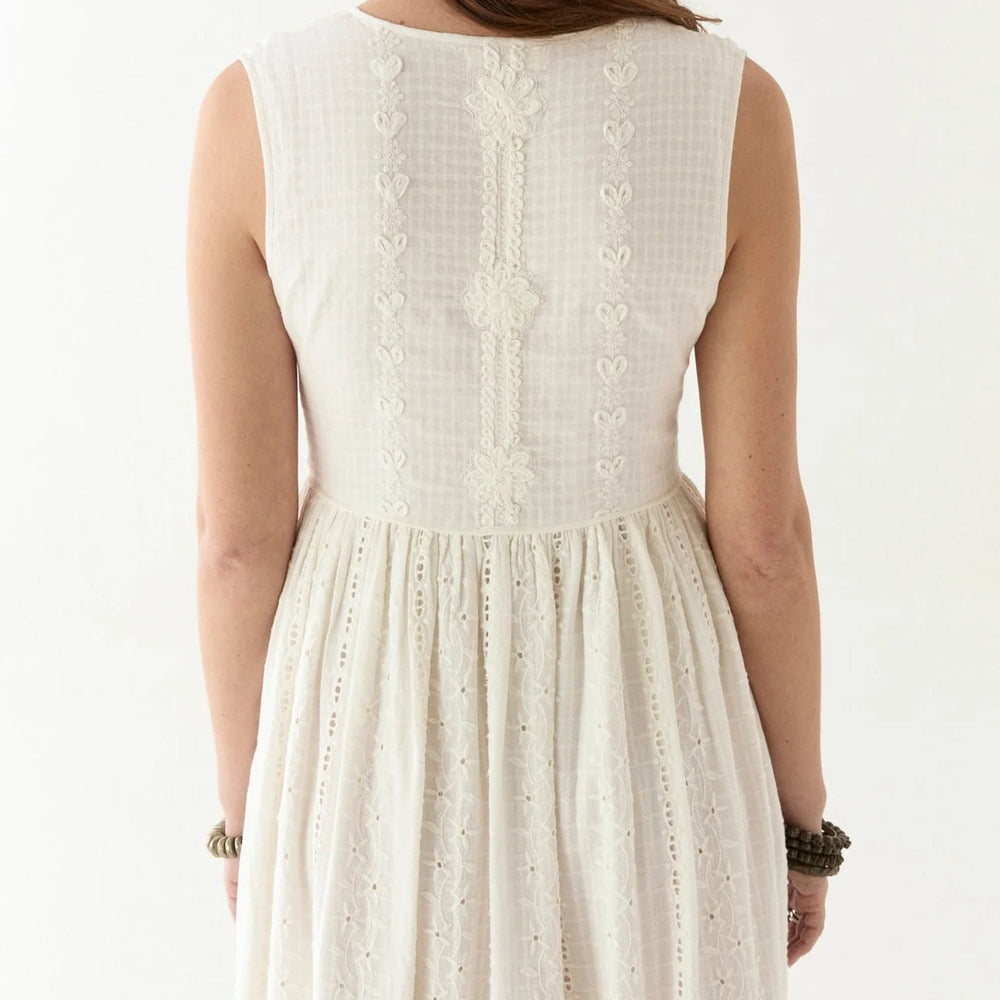 
                      
                        Sleeveless white cotton embroidered dress
                      
                    