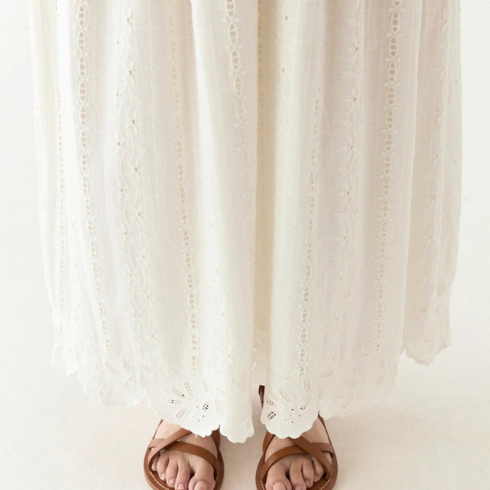 
                      
                        Soft ivory fabric with delicate embroidery
                      
                    