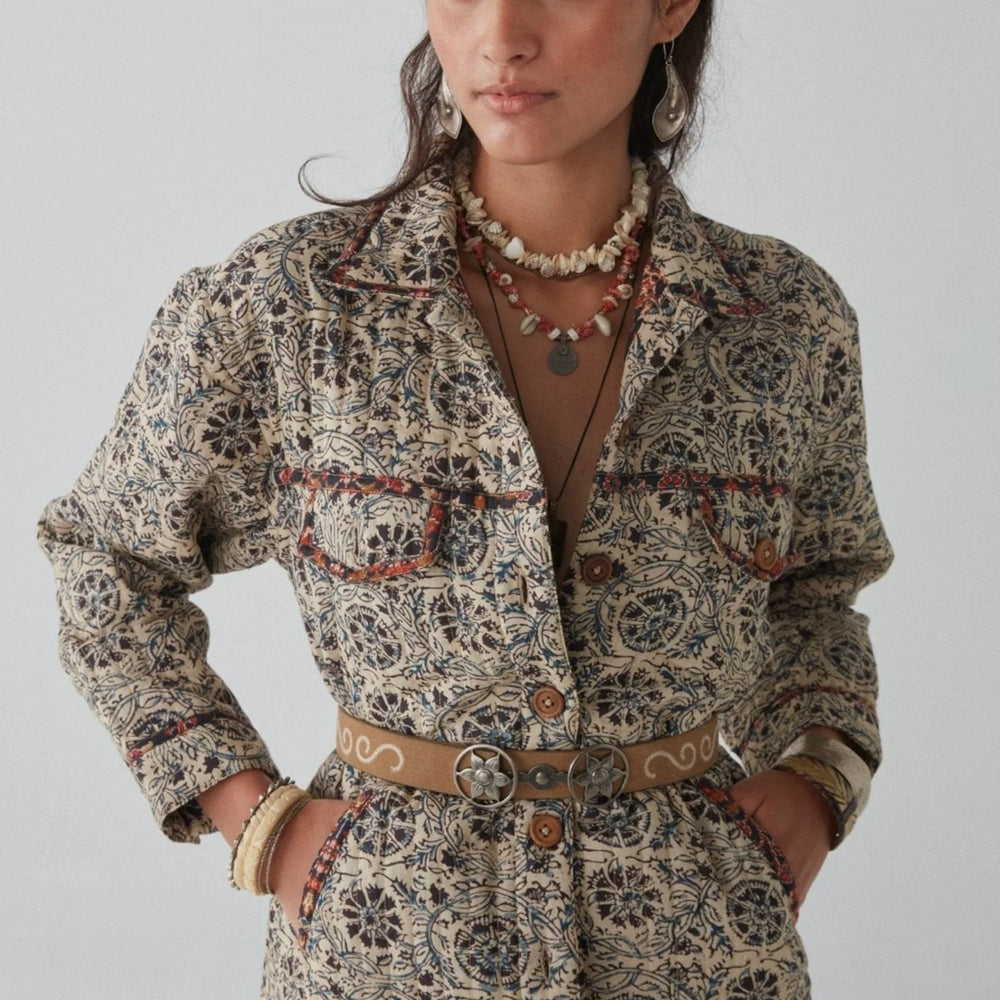 a woman wearing the Anoushka Jacket by Maison Hotel with a belt around it