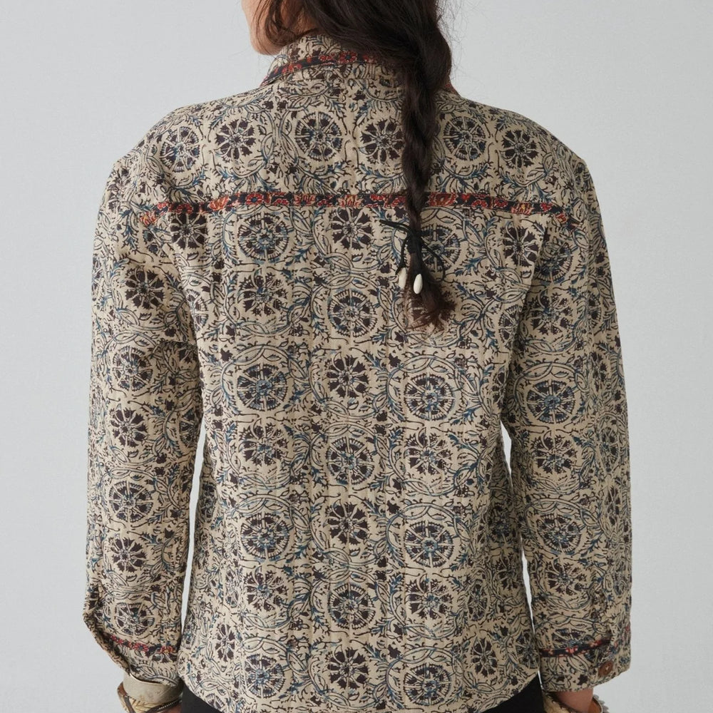 
                      
                        Back view of a woman wearing the Anoushka Jacket by Maison Hotel
                      
                    