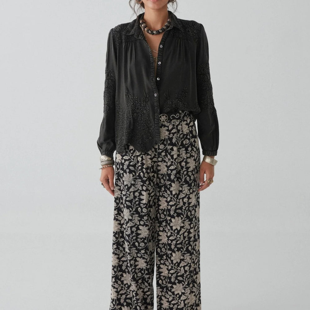 
                      
                        An outfit styled with wide leg floral pants and the Ariana Blouse by Maison Hotel
                      
                    