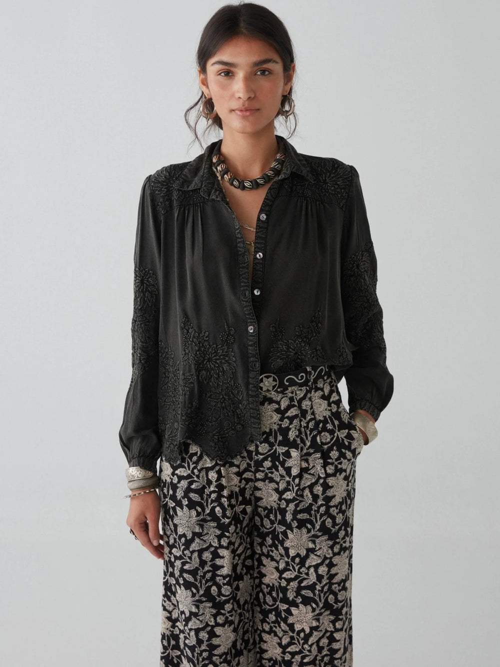 A woman wearing the Ariana Blouse by Maison Hotel