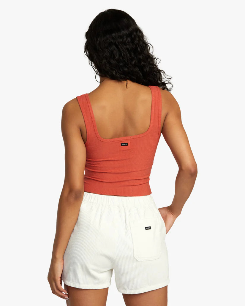 Back view of woman wearing a stretchy rib knit cropped tank top 