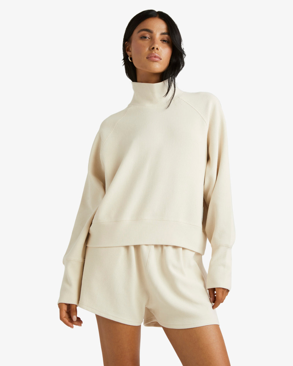 The Sofie Mock Neck Top from RVCA offers a mock neckline and long sleeves