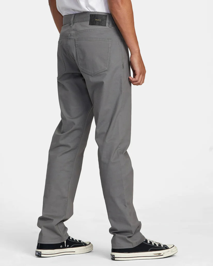 Back view of a man wearing the men's grey 5-pocket Weekend Tech Pants by RVCA