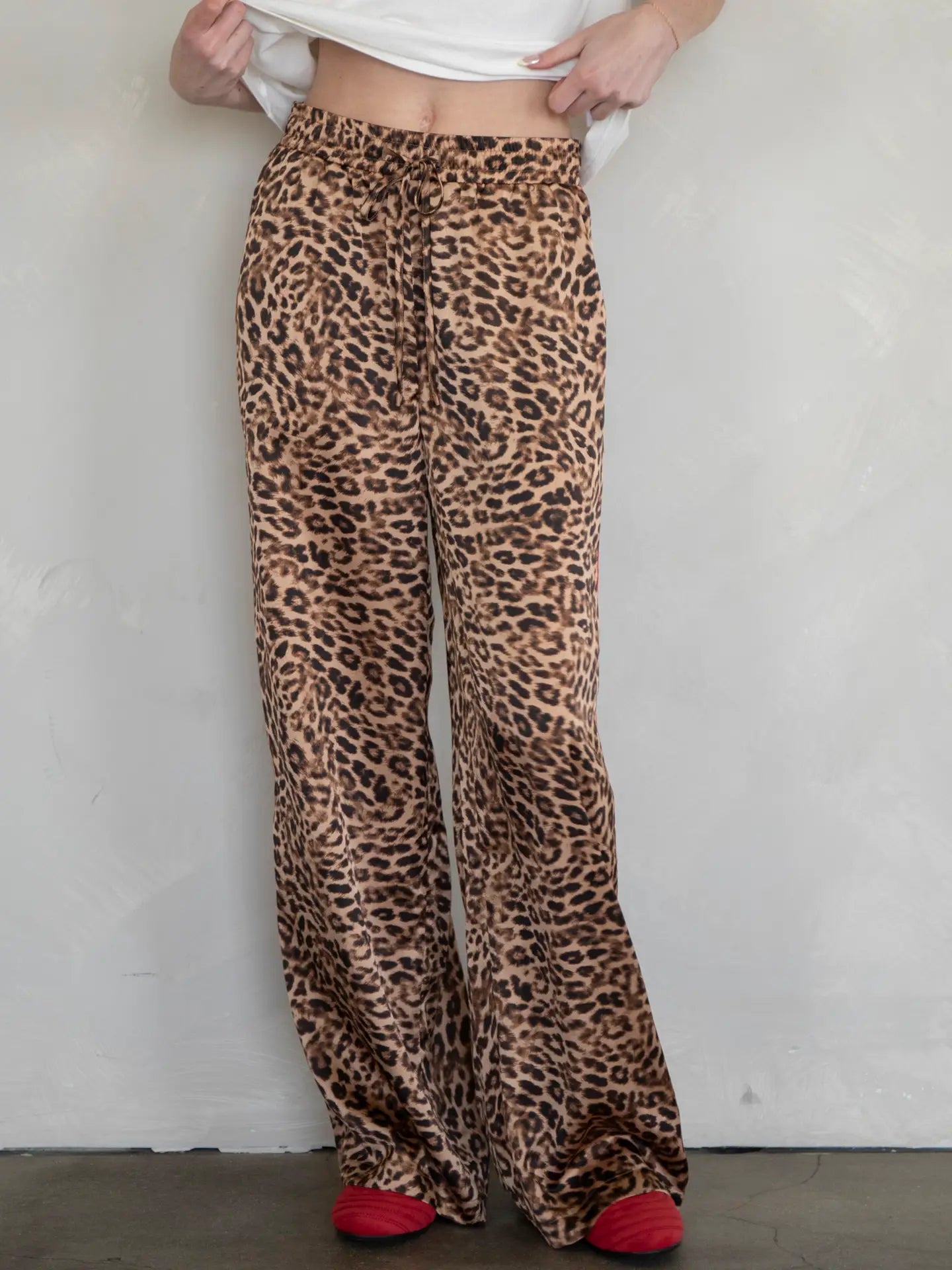 Relax in bold style with these soft and silky leopard lounge pants with a red stripe detail down the sides. Available now at Harbour Thread in Burlington, VT!