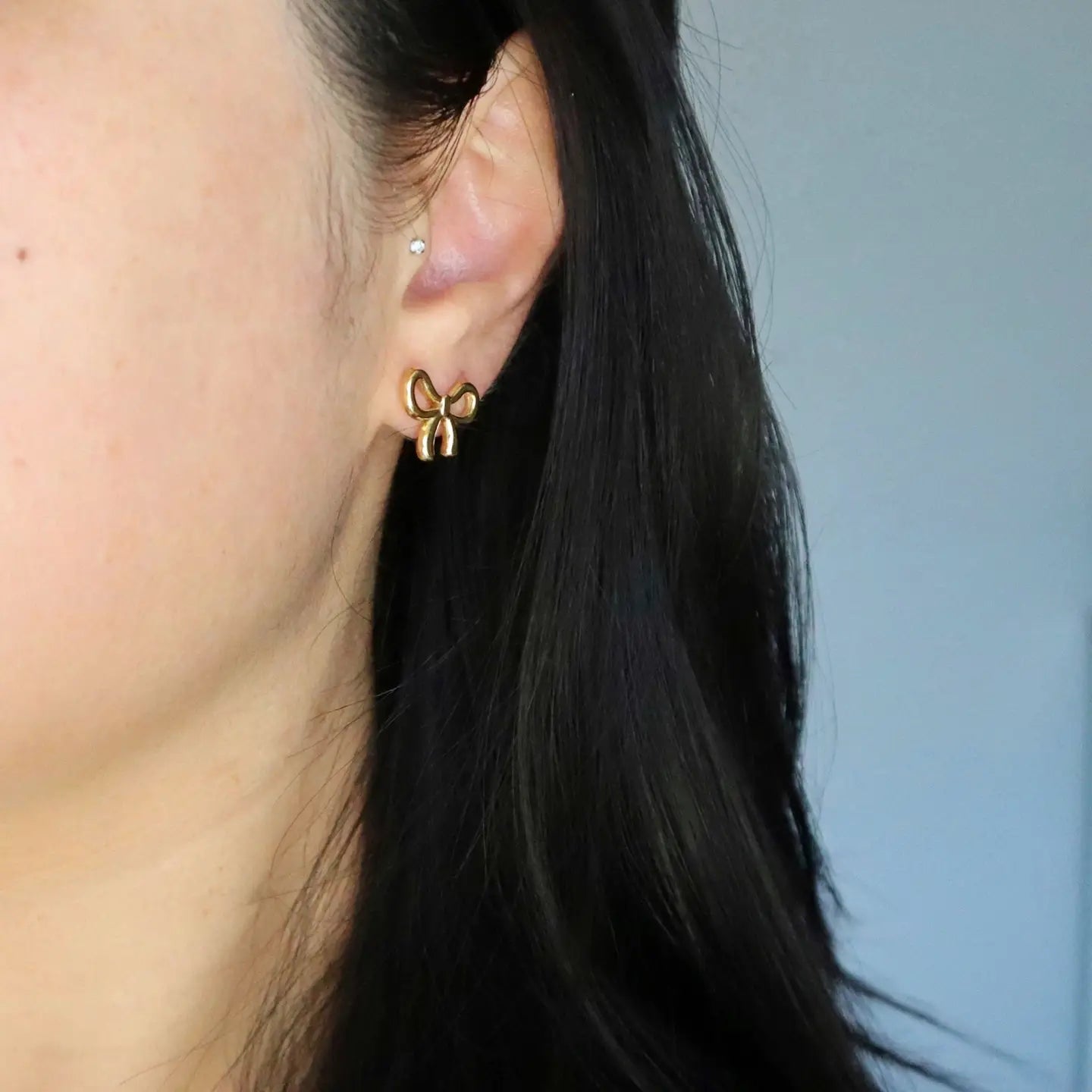 Gold plated bow design stud earrings