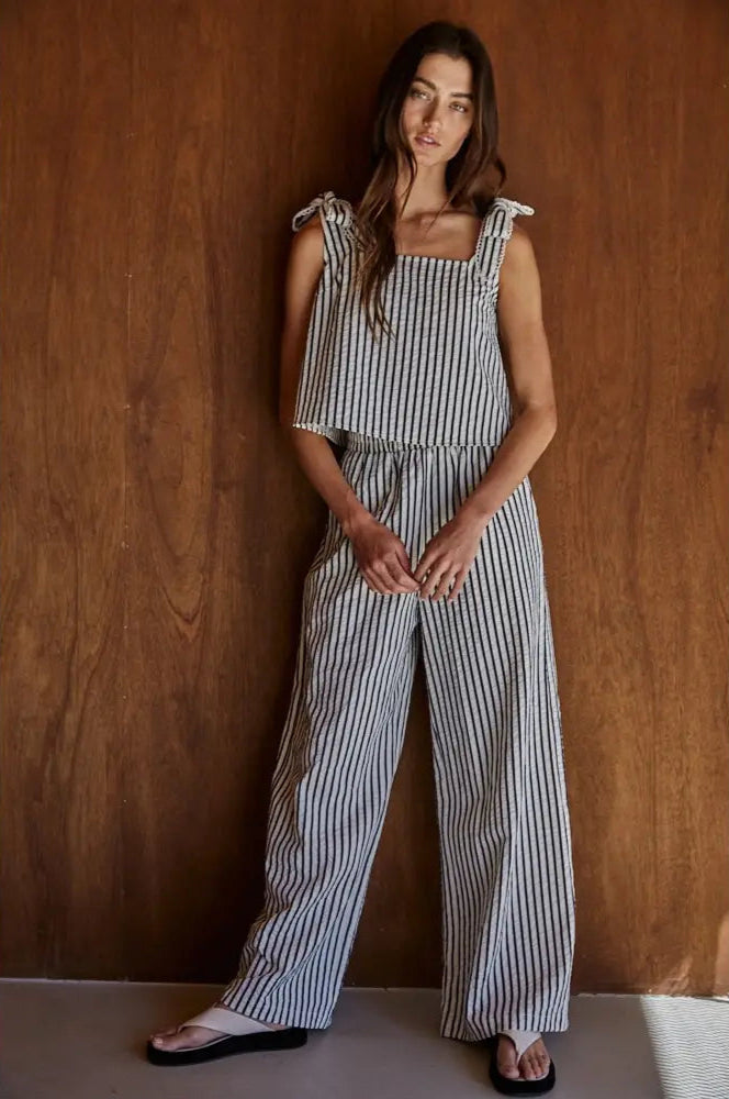 With an airy feel and comfortable elastic waistband, these striped wide leg pants set the foundation for dreamy warm-weather outfits. Shop your pair at Harbour Thread boutique in St. Pete, FL!
