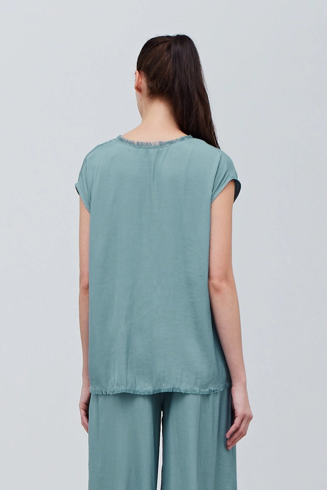 
                      
                        Back view of the short sleeve High Tide Shell Blouse sold at Harbour Thread
                      
                    