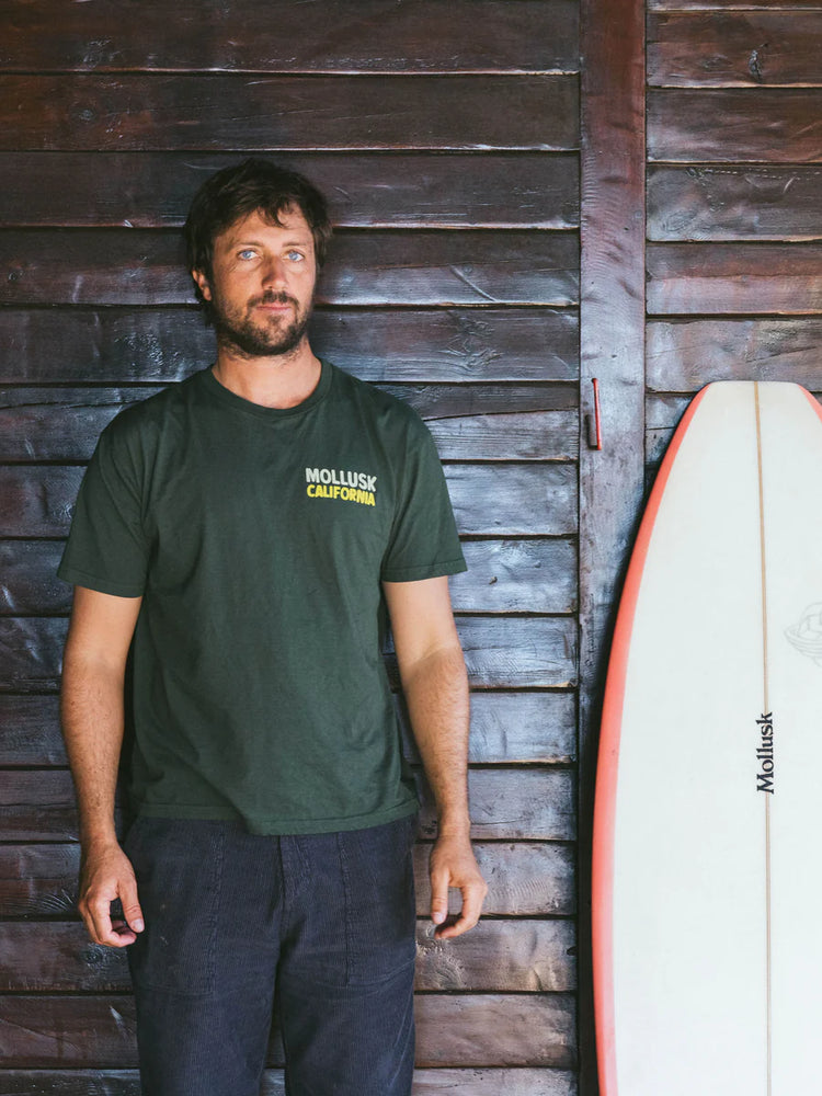 
                      
                        Man wearing Mollusk's Beach Craft Tee
                      
                    