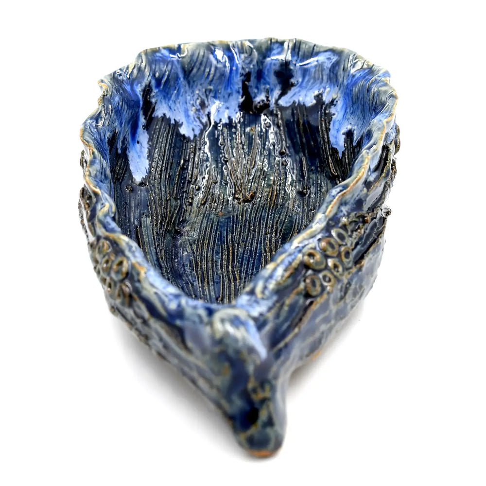 
                      
                        Back view of the Blue Oyster Sculpture by Art Floral Trading
                      
                    