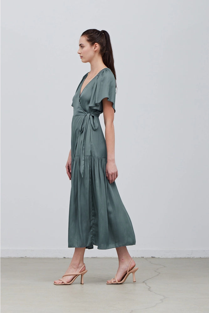 
                      
                        Side view of a dusty teal satin wrap maxi dress
                      
                    