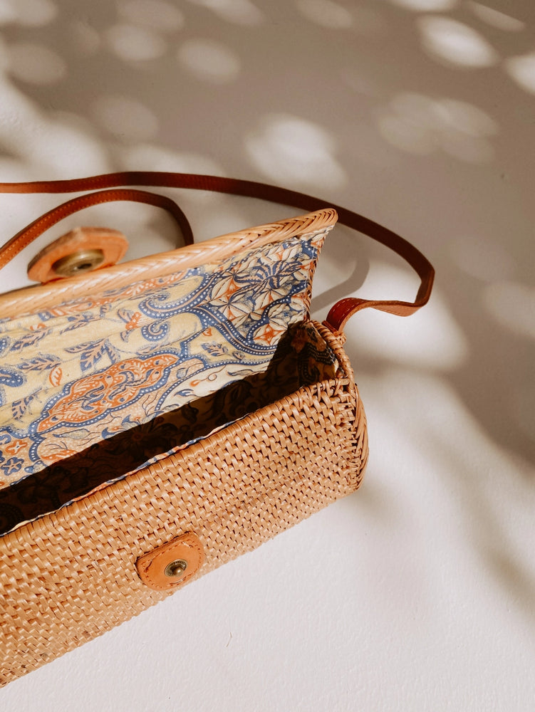 
                      
                        Open view of the Ulan Rattan Purse by Village Thrive
                      
                    