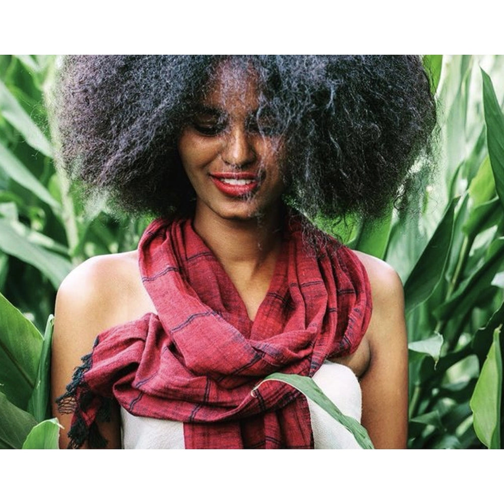 
                      
                        A woman wearing the merlot Slate + Salt Earthy Striped Scarf
                      
                    