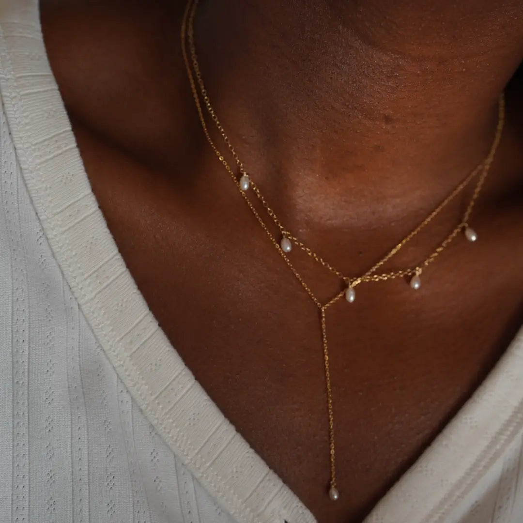 The Five Pearl Necklace by May Martin is perfect for layering with other chains