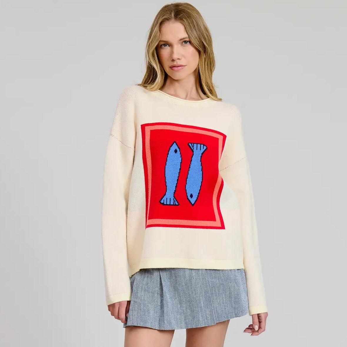 A woman wearing the Flat White Sardine Box Sweater Top