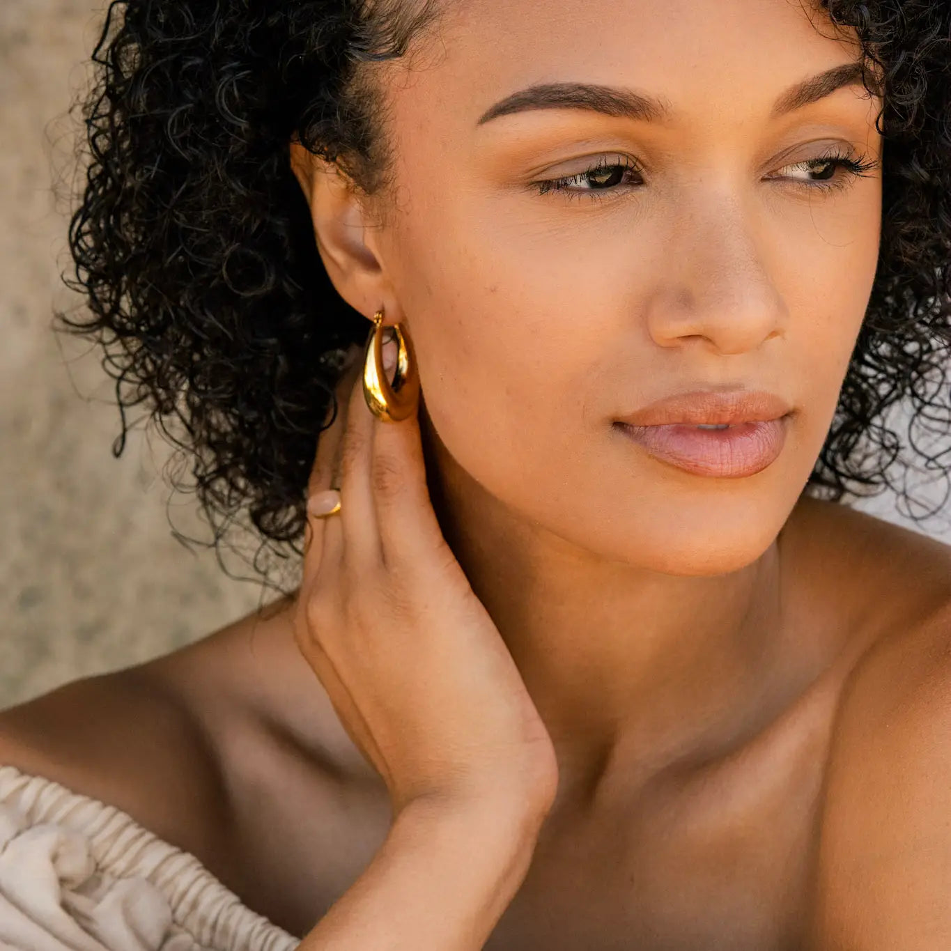 A woman wearing the Boem Collection Priscilla Hoops