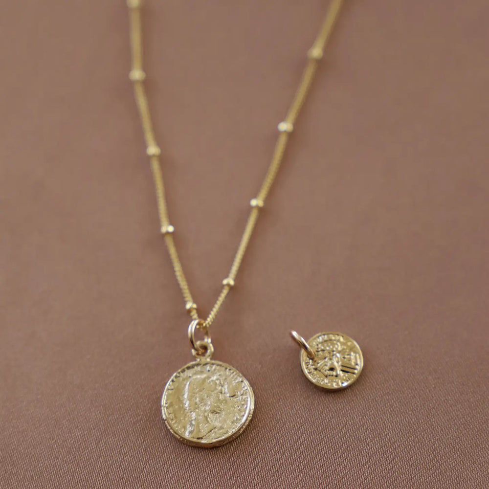 
                      
                        Interchangeable charm detail on the Coin Charm Necklace by Katie Waltman Jewelry
                      
                    