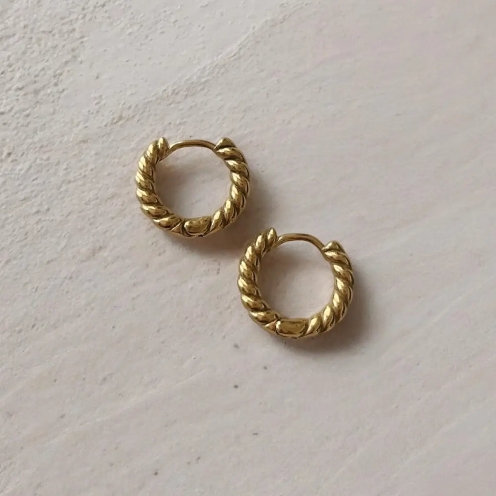 Snug gold hoops with a twisted design