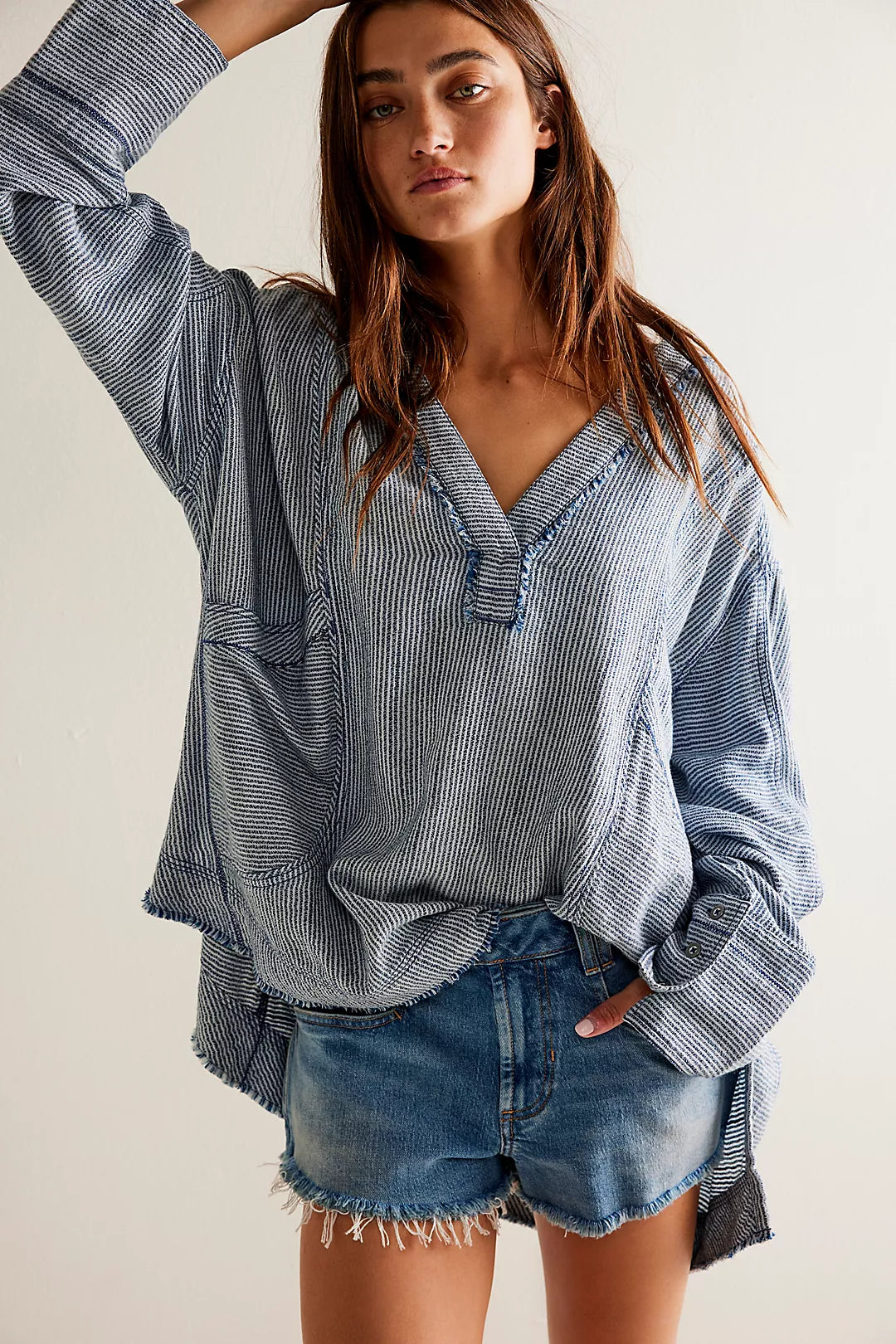 Women's oversized, slouchy striped top with a deep v-neckline