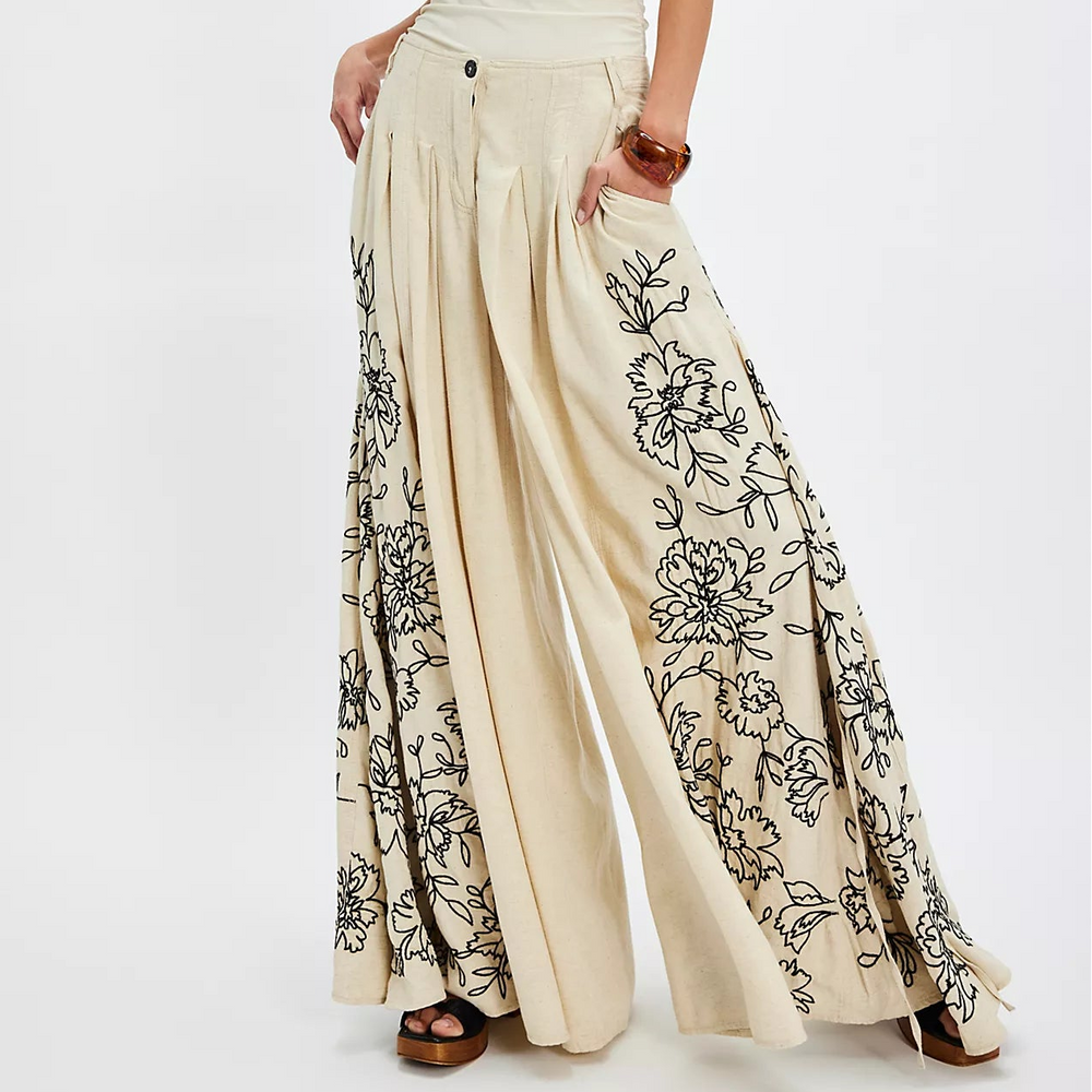 Woman wearing a beige embroidered pants from Free People