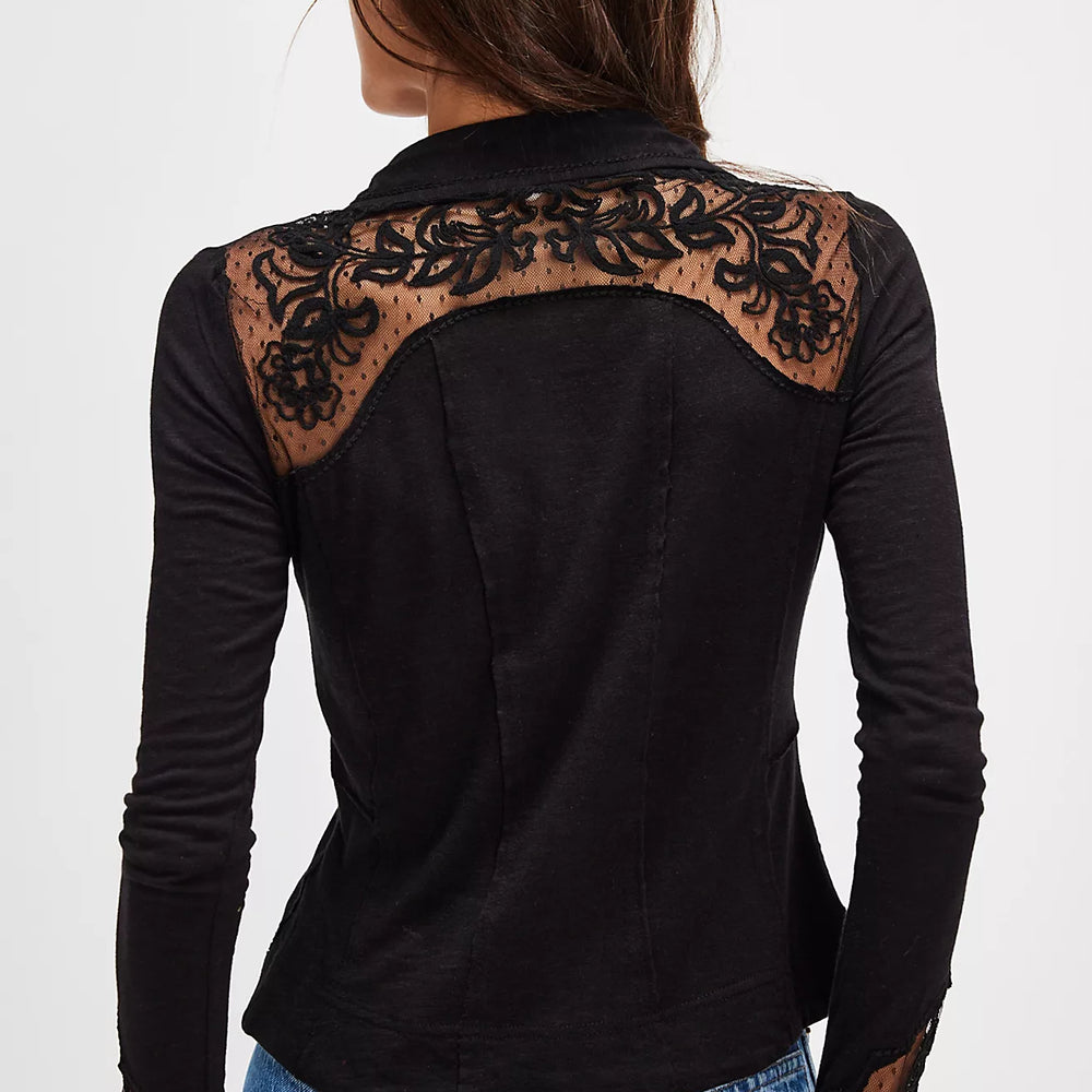 Black long-sleeve top with lace details on a white background