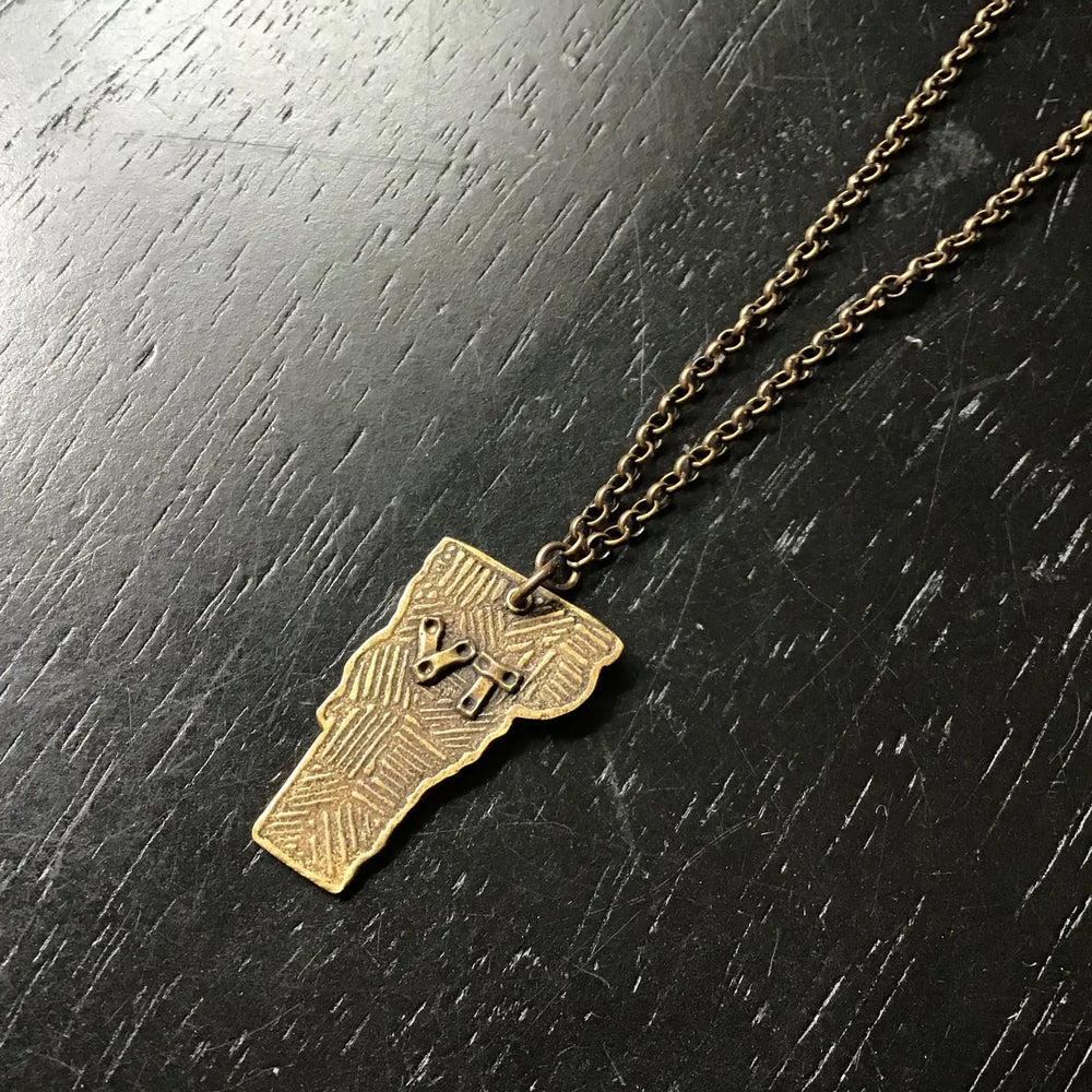 Shop the Large Vermont Pendant Necklace in Brass by local Vermont maker Jennifer Kahn Jewelry at Harbour Thread women's boutique in Burlington, VT.
