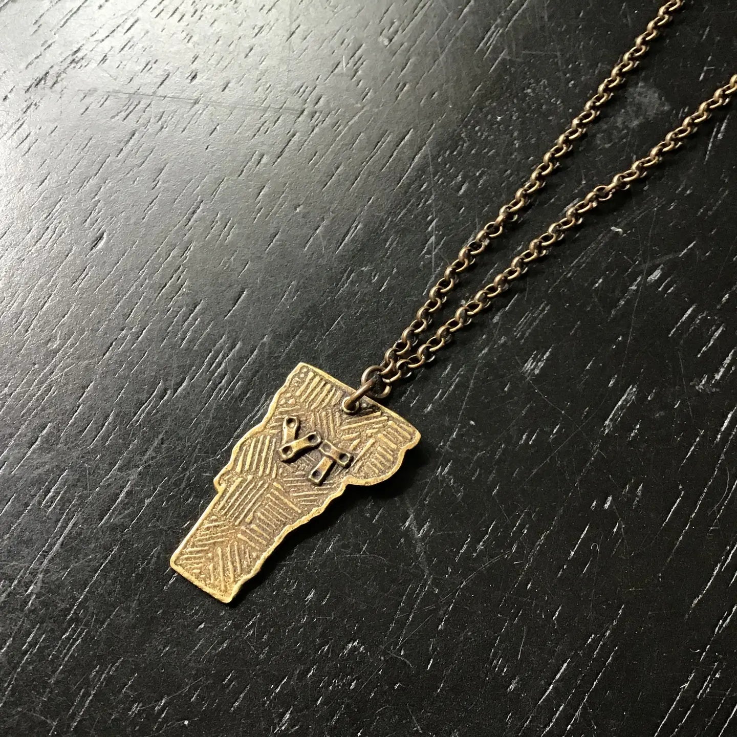 Shop the Large Vermont Pendant Necklace in Brass by local Vermont maker Jennifer Kahn Jewelry at Harbour Thread women's boutique in Burlington, VT.