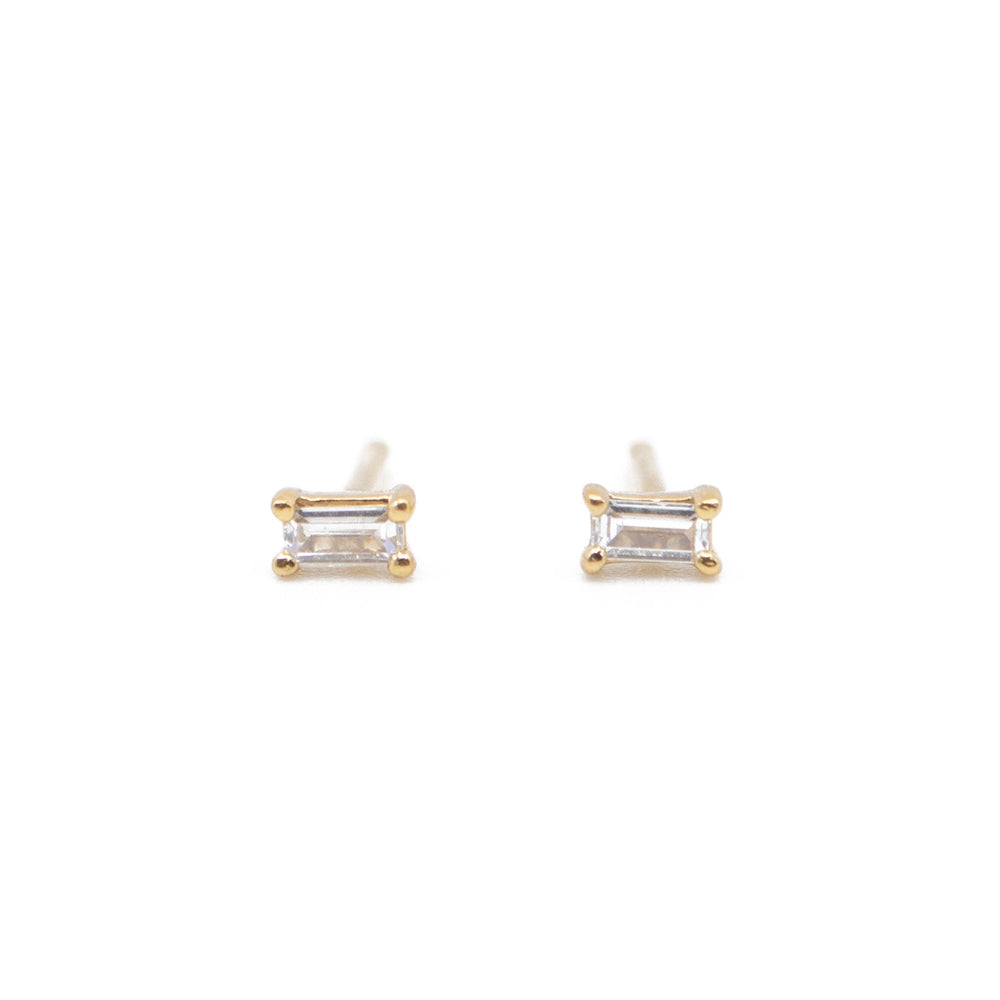 
                      
                        Front detail on the Dara Clear CZ Baguette Gold Stud Earrings by The Land Of Salt
                      
                    