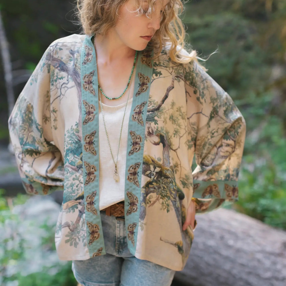 Front view of a woman wearing the Earth and Sky Cropped Bamboo Kimono Cardigan by Market Of Stars