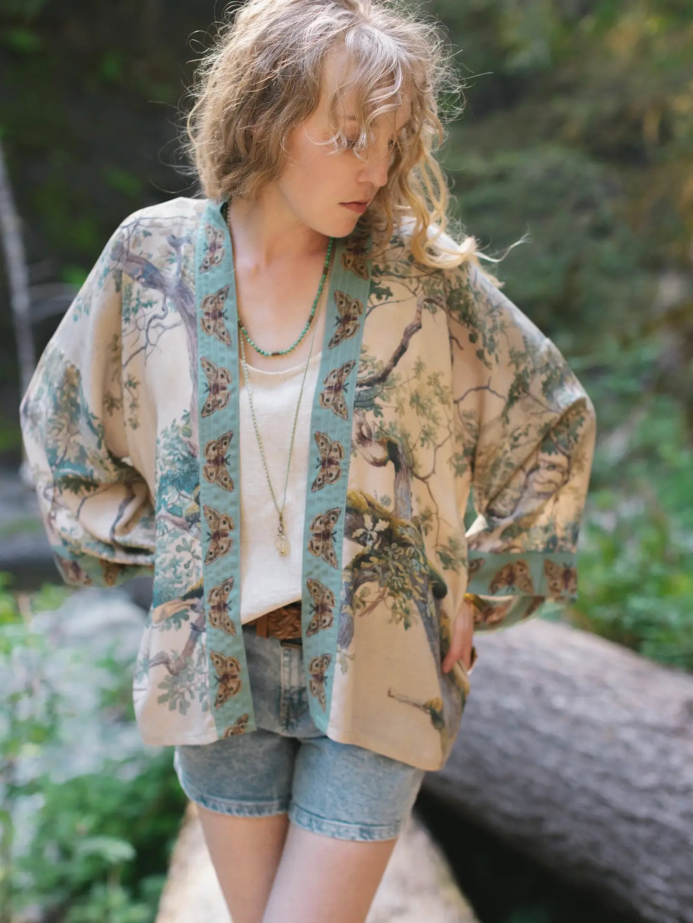 Front view of a woman wearing the Earth and Sky Cropped Bamboo Kimono Cardigan by Market Of Stars