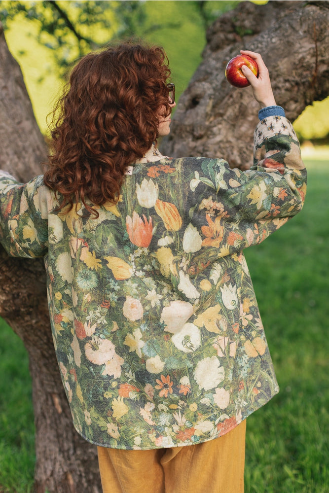 Back view of a woman wearing the I Dream in Flowers Cozy Bees Fleece Cardigan Kimono Jacket by the brand Market Of Stars. 