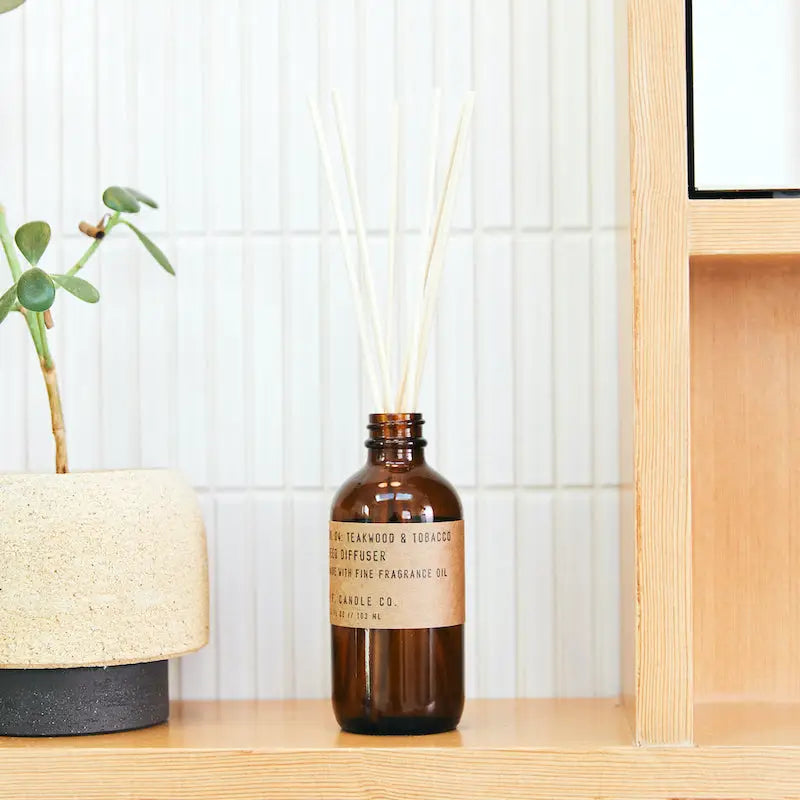 Elevate your space with the 3.5 oz Teakwood & Tobacco Reed Diffuser by P.F. Candle Co., available at Harbour Thread boutique!