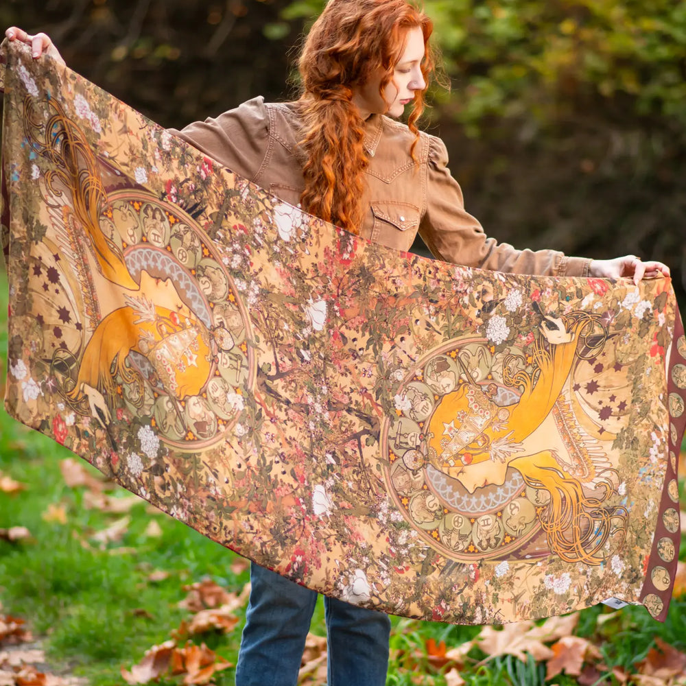 
                      
                        A woman holding the Dreamweaver Bohemian Bamboo Scarf with Zodiac Signs by Market of Stars
                      
                    