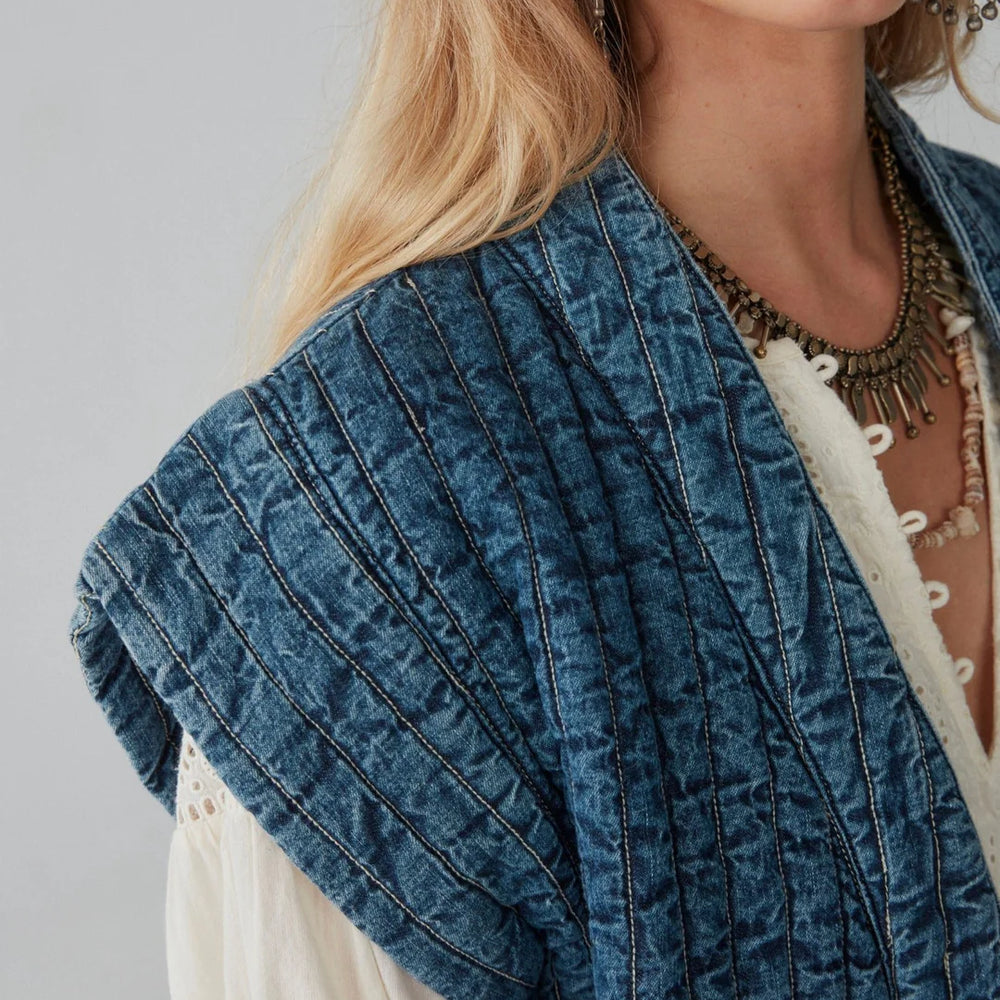 Sleeve detail on the distressed-washed quilted denim Elsa Jacket by Maison Hotel. 