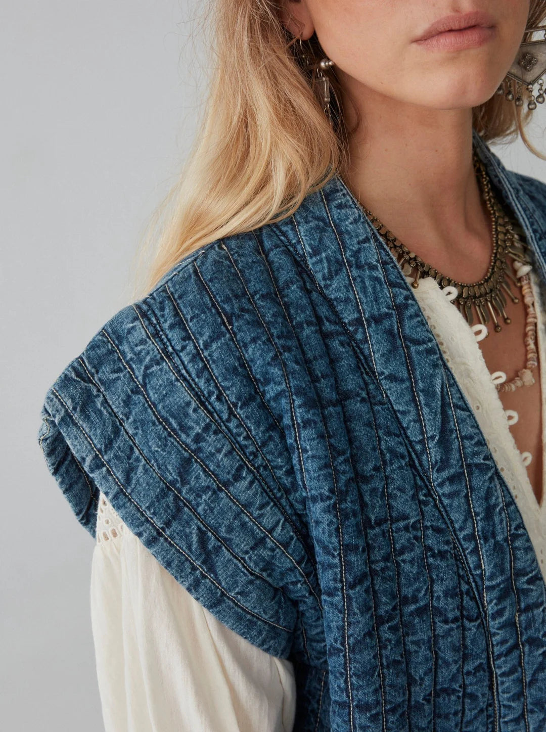 Sleeve detail on the distressed-washed quilted denim Elsa Jacket by Maison Hotel. 