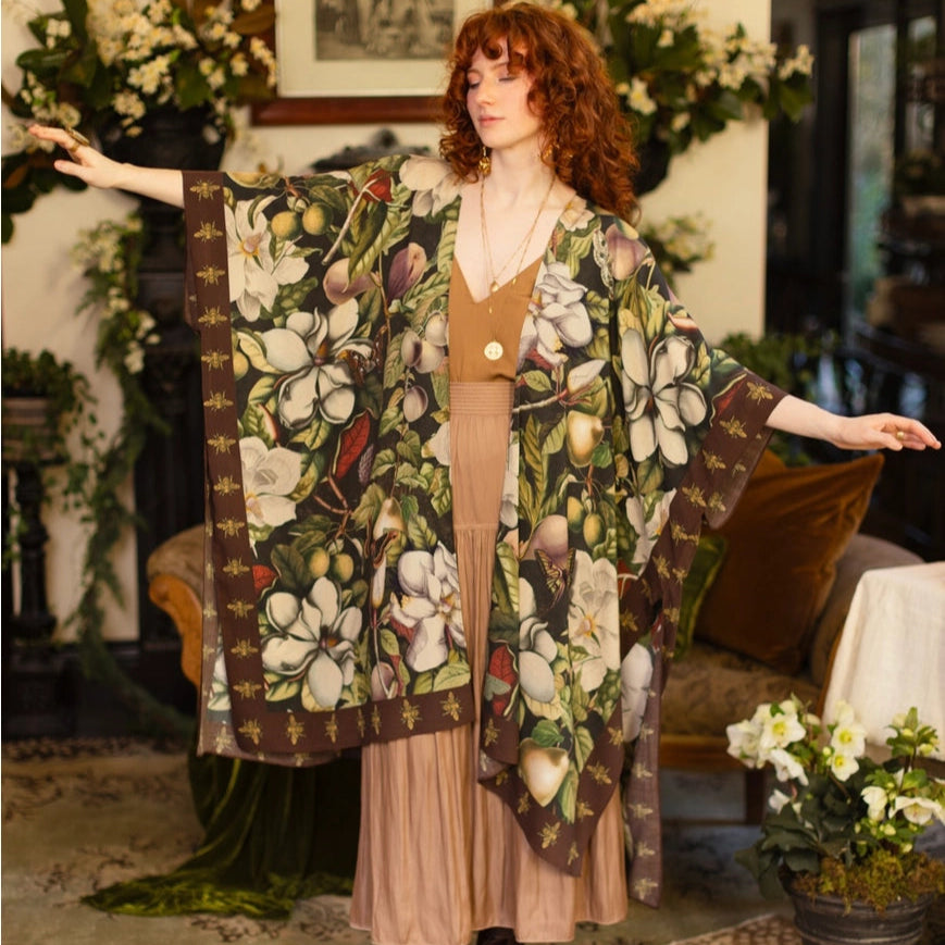 A woman wearing the Market Of Stars Fleur De Lune Goddess Starduster Kimono