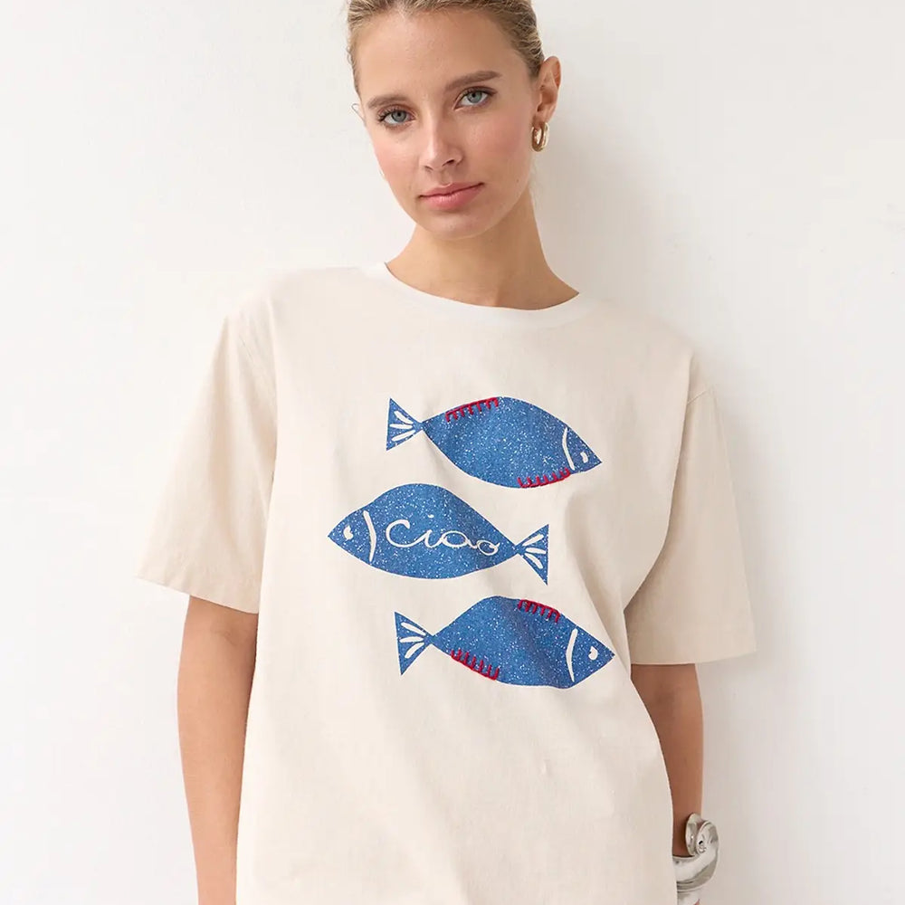 Embrace on-trend casual summer style with the Ciao Fish Graphic Tee at Harbour Thread women's boutique in Burlington, VT. 