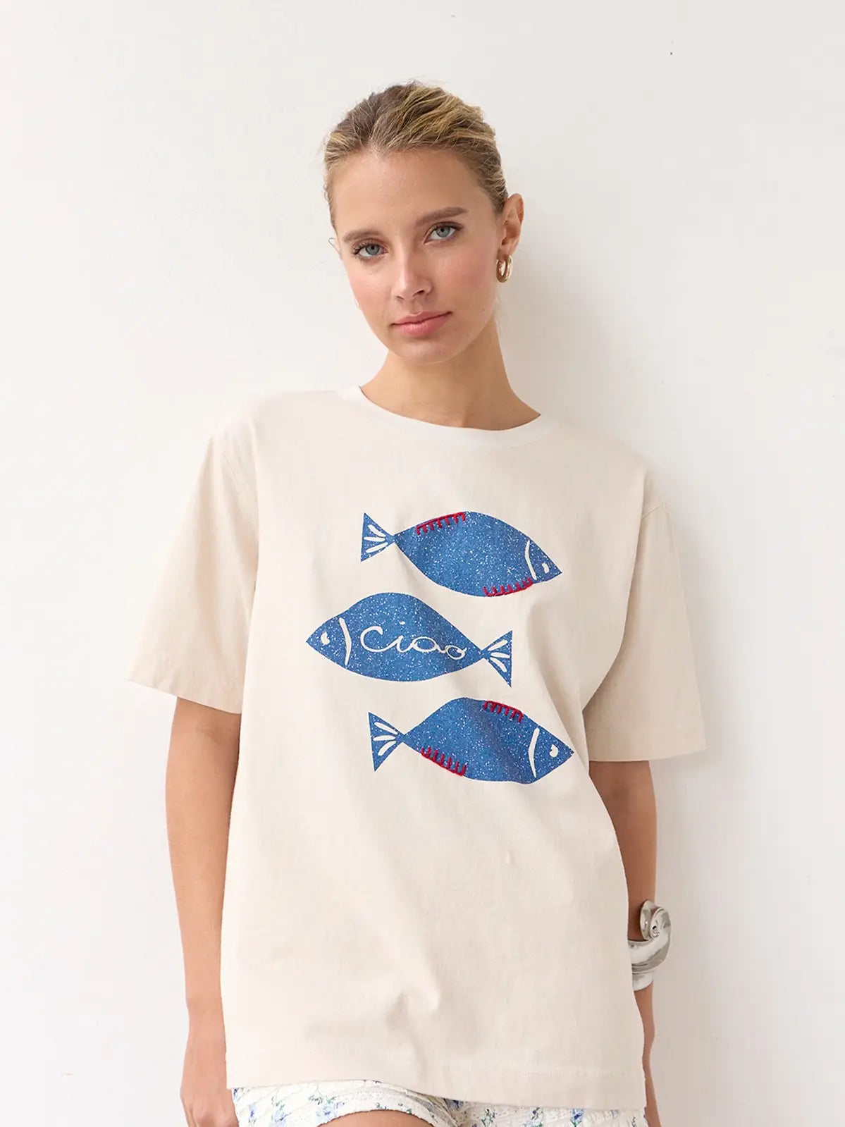 Embrace on-trend casual summer style with the Ciao Fish Graphic Tee at Harbour Thread women's boutique in Burlington, VT. 