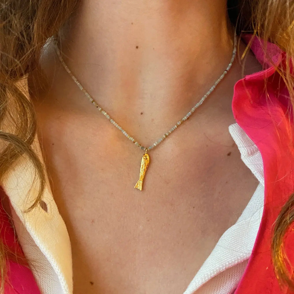 Woman wearing the Loura Gold-Plated Amazonite and Fish Necklace by Sophie Deschamps Bijoux